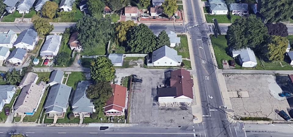 Aerial view of Art's Varsity Pizza and its parking lot on Main Street.